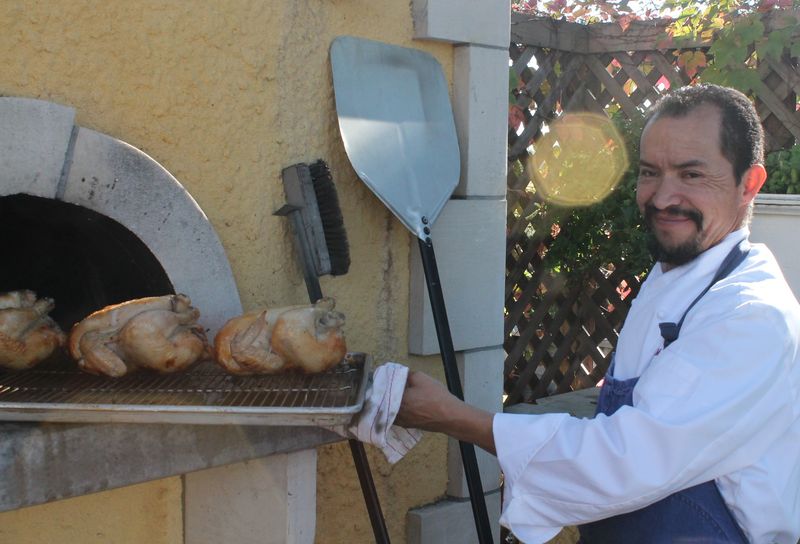 Chickens Roasting in the Wood Burning Oven- Cropped